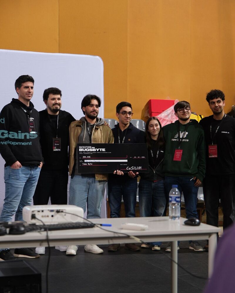 Team holding the prize check